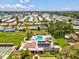 Aerial view showing the neighborhood amenities: community pool, clubhouse, and shuffleboard court at 4567 Great Lakes S Dr, Clearwater, FL 33762
