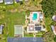 Aerial view of the community pool, shuffleboard court, and clubhouse at 4567 Great Lakes S Dr, Clearwater, FL 33762