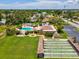 Aerial view of community pool, shuffleboard, clubhouse, parking lot, and green space at 4567 Great Lakes S Dr, Clearwater, FL 33762