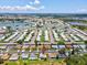 Aerial view of the home in a large community with lakes and winding roads at 4567 Great Lakes S Dr, Clearwater, FL 33762
