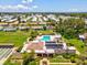 Aerial view of the community with a pool, shuffleboard courts, and clubhouse at 4567 Great Lakes S Dr, Clearwater, FL 33762