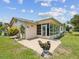 This backyard features an outdoor patio, a screen room, and manicured landscaping at 4567 Great Lakes S Dr, Clearwater, FL 33762