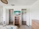 Bedroom featuring two walk-in closets, and a TV at 4567 Great Lakes S Dr, Clearwater, FL 33762