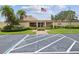 A community clubhouse featuring a flag pole and easy accessibility from the parking lot at 4567 Great Lakes S Dr, Clearwater, FL 33762