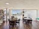 A bright game room boasts wood-look flooring and is furnished with round tables and comfortable chairs at 4567 Great Lakes S Dr, Clearwater, FL 33762