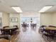 A community game room with wood-look floors, seating, and tables, providing a place to socialize at 4567 Great Lakes S Dr, Clearwater, FL 33762