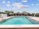 A beautiful community pool with a shallow end marked at 6 ft 9 in and surrounded by lounge chairs at 4567 Great Lakes S Dr, Clearwater, FL 33762