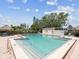 Community swimming pool surrounded by lush greenery, ideal for relaxation and recreation at 4567 Great Lakes S Dr, Clearwater, FL 33762