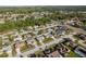 Neighborhood aerial showcasing diverse homes, lush trees, and nearby highway access for convenience at 4752 Weasel Dr, New Port Richey, FL 34653