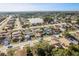 A residential neighborhood features a mix of single-Gathering homes and landscaped yards near a pond at 4752 Weasel Dr, New Port Richey, FL 34653