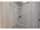 Bathroom featuring white subway tile, a shower-tub combination and a white vanity at 4752 Weasel Dr, New Port Richey, FL 34653