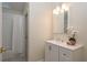 Bathroom featuring white vanity, framed mirror, modern lighting and shower-tub combination with white subway tile at 4752 Weasel Dr, New Port Richey, FL 34653