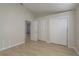 Clean bedroom features a closet, light wood flooring, and neutral paint at 4752 Weasel Dr, New Port Richey, FL 34653