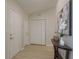 Inviting entryway with stylish decor, featuring a console table and a white closet at 4752 Weasel Dr, New Port Richey, FL 34653