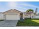 Charming single-story home featuring a well-maintained lawn and a two-car garage at 4752 Weasel Dr, New Port Richey, FL 34653