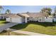 Charming single-story home with well-manicured lawn and attached garage at 4752 Weasel Dr, New Port Richey, FL 34653