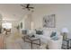Bright living room seamlessly connects to the dining area with modern decor and ample natural light at 4752 Weasel Dr, New Port Richey, FL 34653