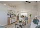 Bright living room seamlessly connects to the dining area with modern decor and ample natural light at 4752 Weasel Dr, New Port Richey, FL 34653