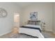 Bright primary bedroom featuring a ensuite bathroom, luxury rug and modern decor at 4752 Weasel Dr, New Port Richey, FL 34653