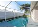 Screened-in private pool offers a refreshing escape with a spacious deck for relaxation and entertaining at 4752 Weasel Dr, New Port Richey, FL 34653