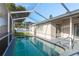 A refreshing screened-in pool providing a private and relaxing outdoor space at 4752 Weasel Dr, New Port Richey, FL 34653