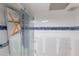 Bathroom renovation project with new blue accent tiles ready for finishing touches at 4754 Marine Pkwy # 103, New Port Richey, FL 34652
