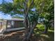 Backyard view with lush greenery and mature trees providing ample shade to the property at 4853 Alcea St, New Port Richey, FL 34652