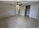 Bedroom with tile flooring, ceiling fan and closet storage at 4853 Alcea St, New Port Richey, FL 34652