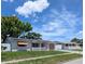 Charming single-story home with a well-maintained lawn, driveway, and an inviting exterior at 4853 Alcea St, New Port Richey, FL 34652