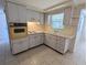 Functional kitchen featuring ample counter space, updated appliances, and a convenient layout at 4853 Alcea St, New Port Richey, FL 34652