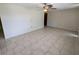 Spacious room with tile floors and ceiling fan, offering a versatile and inviting space at 4853 Alcea St, New Port Richey, FL 34652