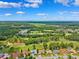 Panoramic aerial view of the residential area with golf course, showcasing the community layout at 5121 Delacroix Dr, Brooksville, FL 34604