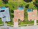 Overhead shot showcasing a house with a backyard pool and well-maintained lawn at 5121 Delacroix Dr, Brooksville, FL 34604