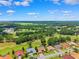 Scenic aerial view captures homes nestled amidst lush green landscape and a golf course at 5121 Delacroix Dr, Brooksville, FL 34604
