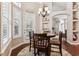Cozy dining area with a round table set under a chandelier near a bright window at 5121 Delacroix Dr, Brooksville, FL 34604
