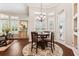 Inviting dining area with hardwood floors, shuttered windows, and a decorative chandelier at 5121 Delacroix Dr, Brooksville, FL 34604