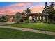 Stunning home featuring mature landscaping, elegant architectural details, and a well-manicured lawn at 5121 Delacroix Dr, Brooksville, FL 34604
