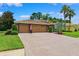 Beautiful home with a spacious brick driveway leading to a two-car garage at 5121 Delacroix Dr, Brooksville, FL 34604
