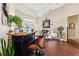 Stylish living room with a bar area, comfortable seating, and elegant tray ceilings at 5121 Delacroix Dr, Brooksville, FL 34604