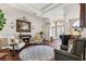 Elegant living room featuring a fireplace, comfortable seating, and an open floor plan at 5121 Delacroix Dr, Brooksville, FL 34604
