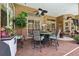 Covered patio area with a dining table, chairs, and a ceiling fan for outdoor gatherings at 5121 Delacroix Dr, Brooksville, FL 34604