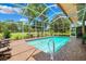 Sparkling screened-in pool with a brick-paved deck, offering a perfect spot for summer fun at 5121 Delacroix Dr, Brooksville, FL 34604
