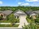 Birds eye view of a well-maintained single story home with lush backyard and inviting curb appeal at 6130 Colmar Pl, Apollo Beach, FL 33572
