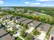 An aerial view highlights this home's location within a charming neighborhood and proximity to a serene lake at 6130 Colmar Pl, Apollo Beach, FL 33572