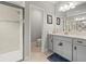 Bathroom featuring modern fixtures, a glass-enclosed shower, and a stylish vanity at 6130 Colmar Pl, Apollo Beach, FL 33572