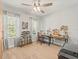Inviting bedroom with a ceiling fan and natural light perfect for a home office or hobby room at 6130 Colmar Pl, Apollo Beach, FL 33572