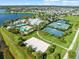This community offers resort-style amenities including swimming pools, tennis courts, and a sand volleyball court at 6130 Colmar Pl, Apollo Beach, FL 33572