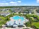 Resort-style community pool with ample seating, splashpad and playground in a neighborhood setting at 6130 Colmar Pl, Apollo Beach, FL 33572