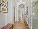 Inviting foyer with archways, beautiful wood-look tile, and stylish decor at 6130 Colmar Pl, Apollo Beach, FL 33572