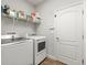 Efficient laundry room with modern washer and dryer units to easily handle everyday tasks at 6130 Colmar Pl, Apollo Beach, FL 33572